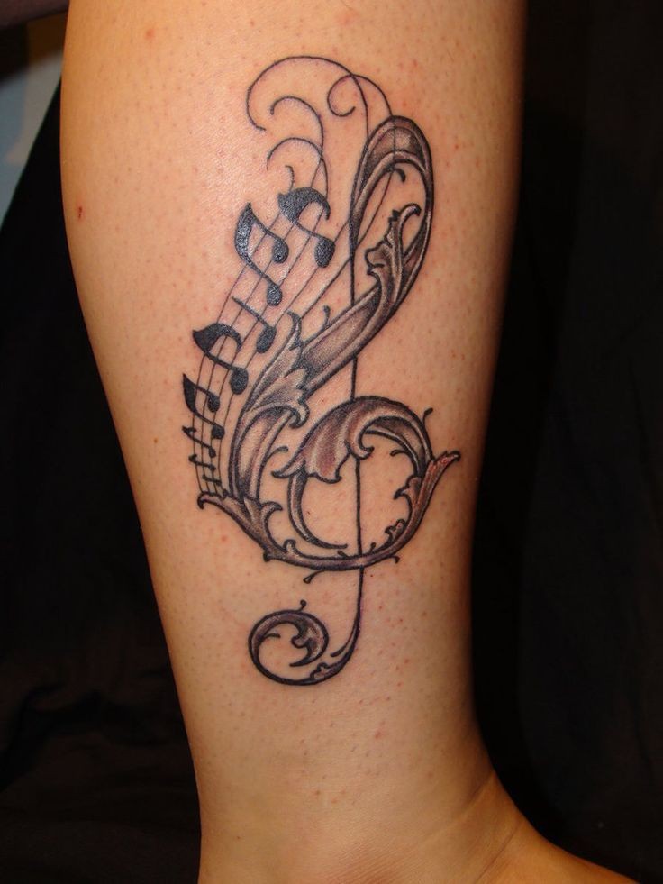 Adorable music clef tattoo on leg