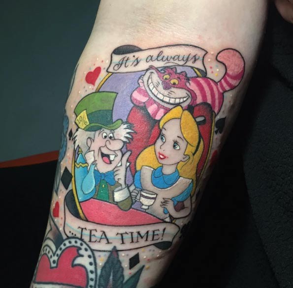 Alice in Wonderland fairy tale heroes having tea multicolored forearm tattoo with banner lettering