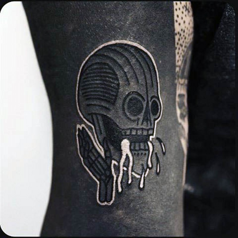 Alien like little black and white skeleton tattoo