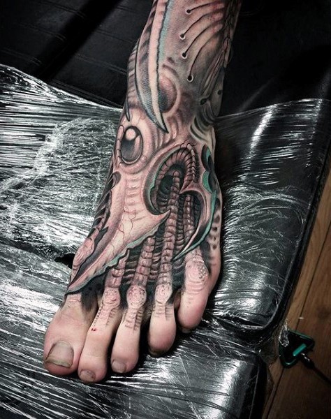 Alien style black and white biomechanical tattoo on foot