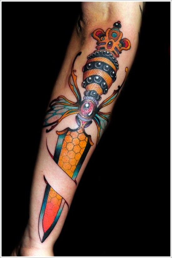 Amazing dagger morphing bee forearm tattoo