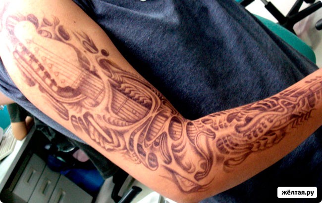 Amazing 3D style very detailed black ink alien skin tattoo on sleeve stylized with guitar