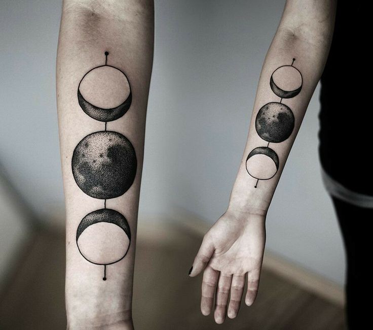 Amazing black ink sun and moon forearm tattoo