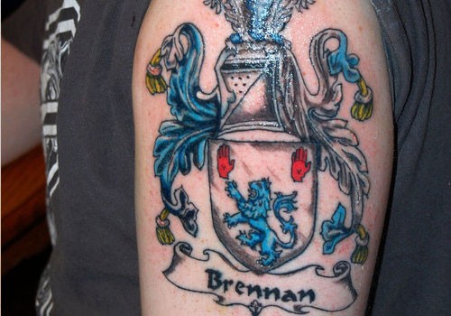 Amazing brennan family crest tattoo on half sleeve