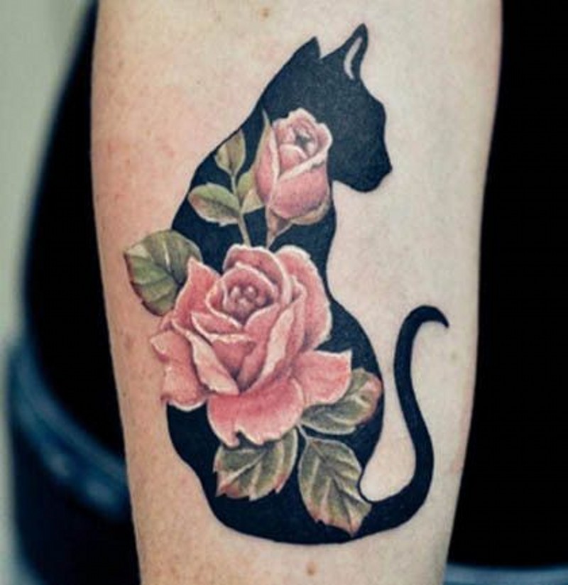 Amazing colored little flowers with shadow cat tattoo on leg