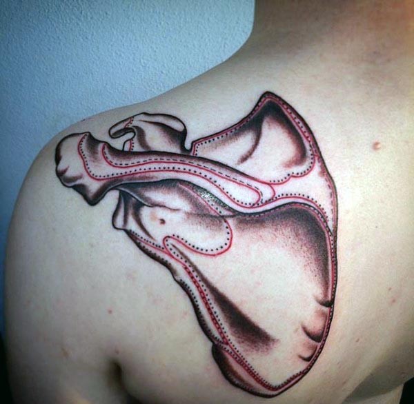 Amazing colored realism style colored shoulder tattoo of human bone