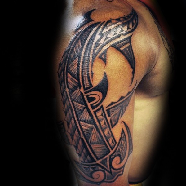 Amazing dark black ink ethnic tribal style hammerhead shark tattoo on man&quots shoulder