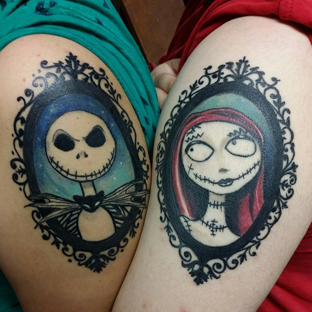 Amazing designed colored couple upper arm tattoos of various monsters portraits