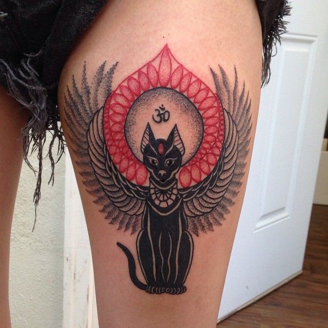 Amazing detailed colored fantasy cat tattoo on thigh with tiny black symbol