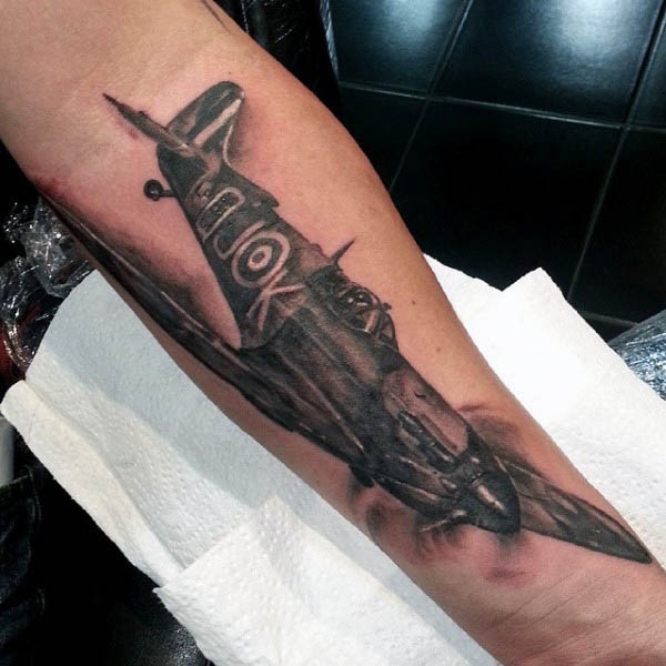 Amazing looking black and gray style detailed forearm tattoo of WW2 fighter plane