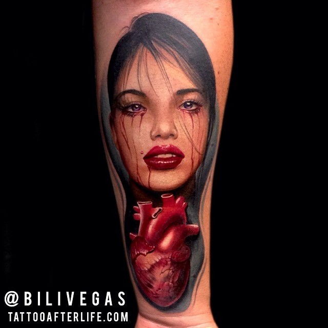 Amazing looking colored forearm tattoo fo bloody woman with heart