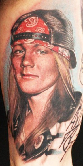 Amazing looking colored portrait style shoulder tattoo of famous rock star