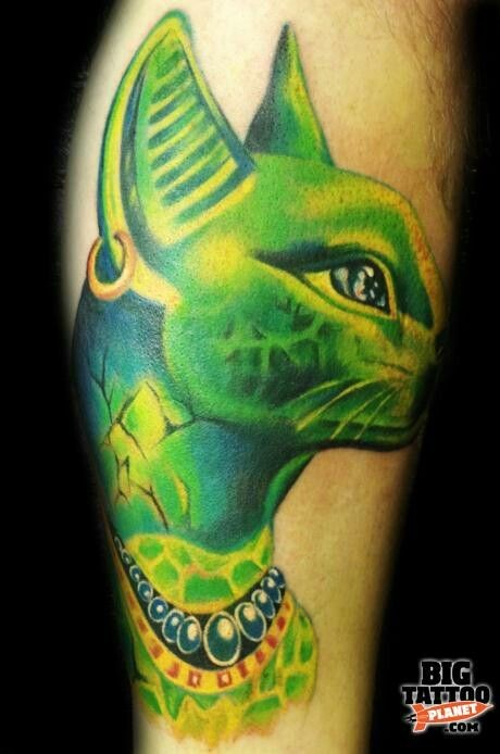 Amazing looking green colored leg tattoo of Egypt cat