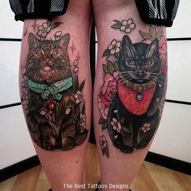 Amazing multicolored legs tattoo of very beautiful maneki neko japanese lucky cat and flowers