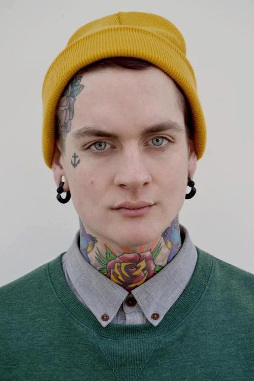 Amazing small face tattoo on mans body