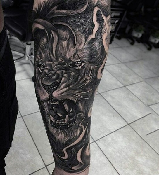 Amazing very detailed black ink roaring lion tattoo on arm