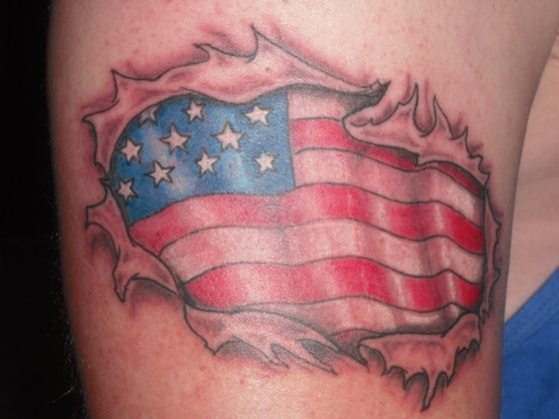 American flag under skin rip tattoo