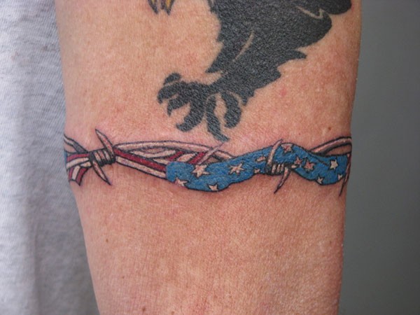 American flag with barbed wire tattoo