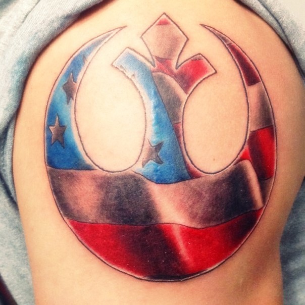 American native big 3D like Rebel Alliance emblem tattoo on shoulder stylized with national flag