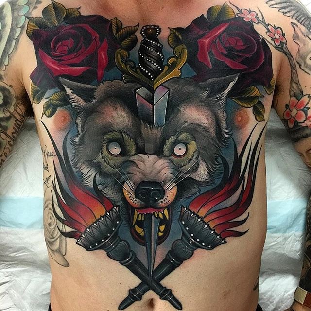 American traditional colored large whole chest tattoo of wolf with dagger and torches