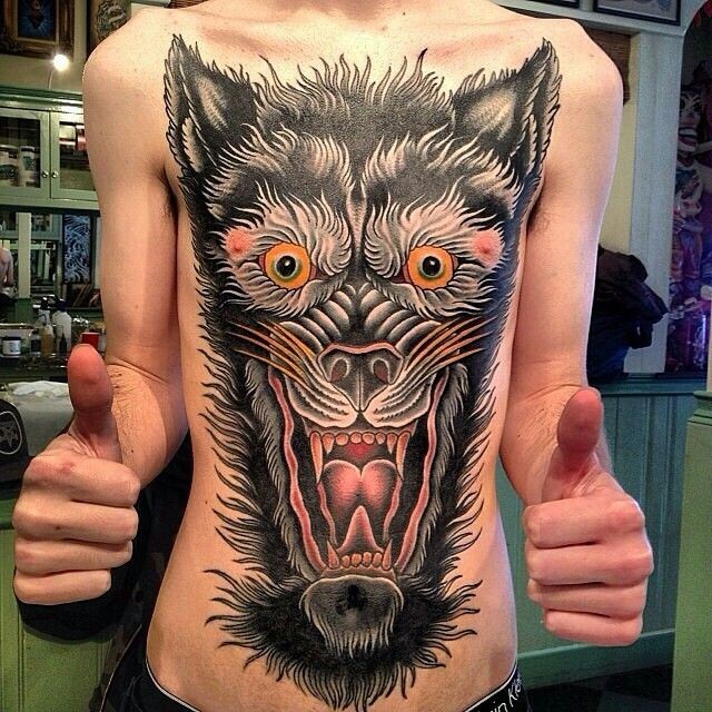 American traditional colored whole chest tattoo of creepy wold head
