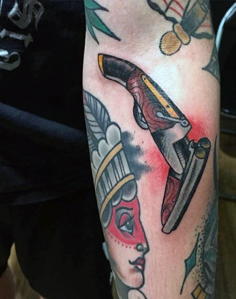 American traditional Indian woman chef and ancient gun colored forearm tattoo
