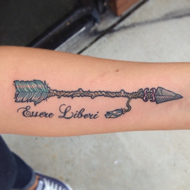 Ancient arrow tattoo with letters on forearm - Tattooimages.biz
