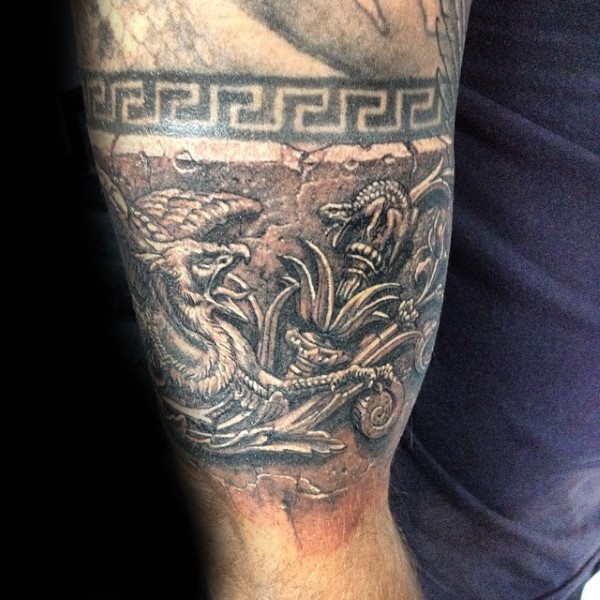Ancient stonework style biceps tattoo of old wall statue
