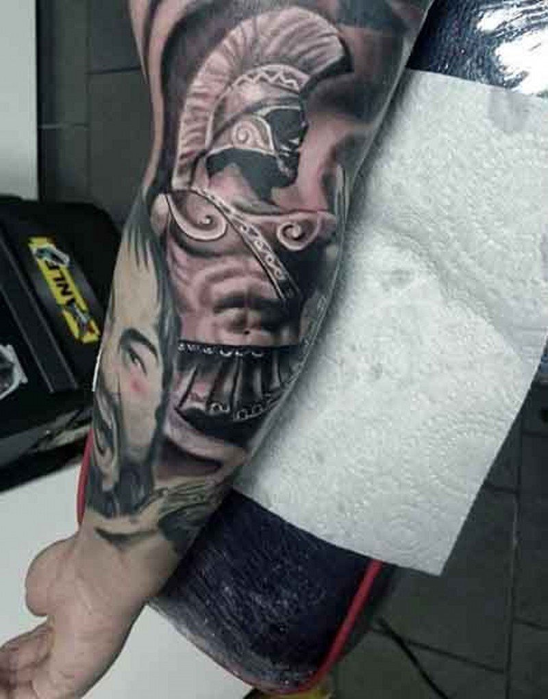 Ancient style colored forearm  tattoo  of warrior  statue 