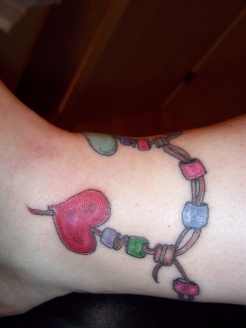 Ankle bracelet color ink heart tattoo