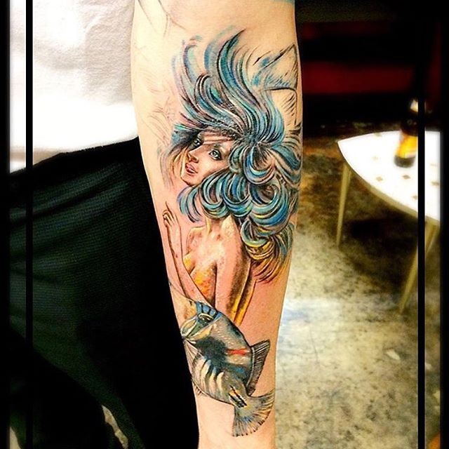 Antic painting like colorful forearm tattoo of mermaid with little fish
