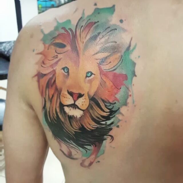 Art style colored scapular tattoo of lion head