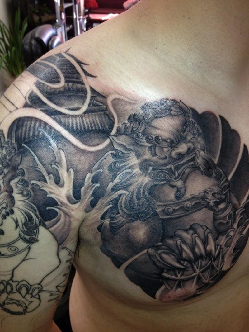 Asian native black and white unfinished chest tattoo of big temple and tiger statue