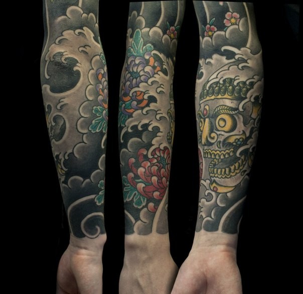 Asian oriental style colored demon sleeve tattoo with chrysanthemum flower in water waves