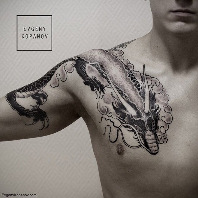 Asian style black and white dragon tattoo on shoulder