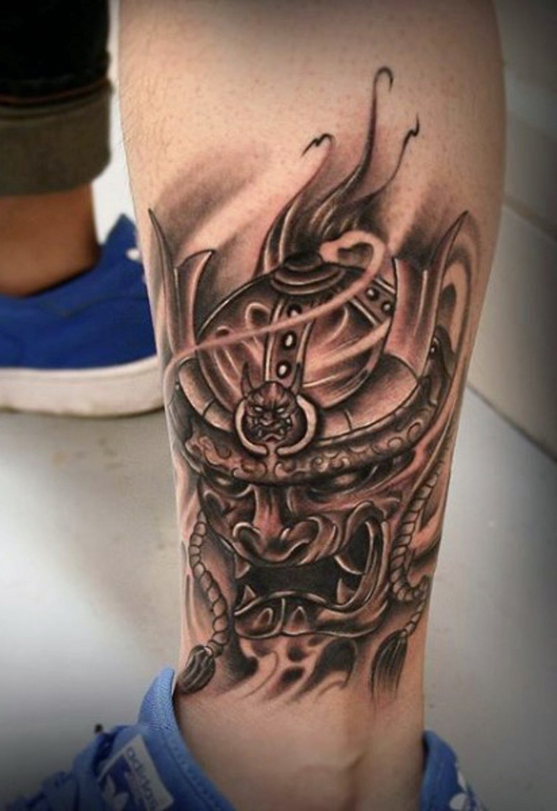 Asian style black and white samurai warrior helmet tattoo on leg