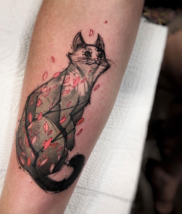 Asian style colored arm tattoo of cat with pink leaves