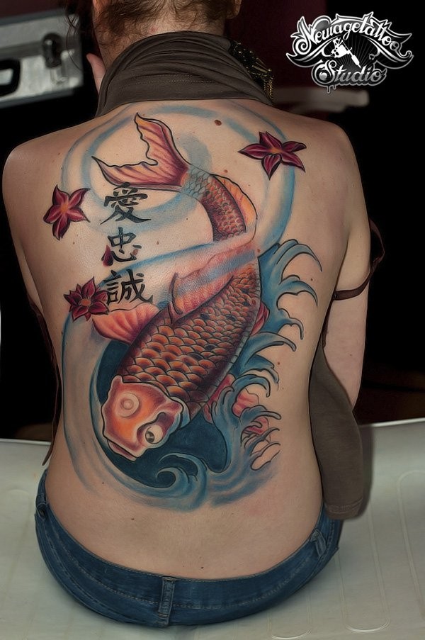 Asian style colored big carp-fish with flowers and lettering tattoo on whole back