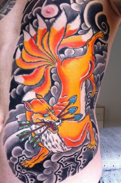 Asian style colored evil creature tattoo on chest