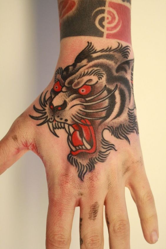 Asian style colored furious Bengal tiger&quots head traditional tattoo on hand