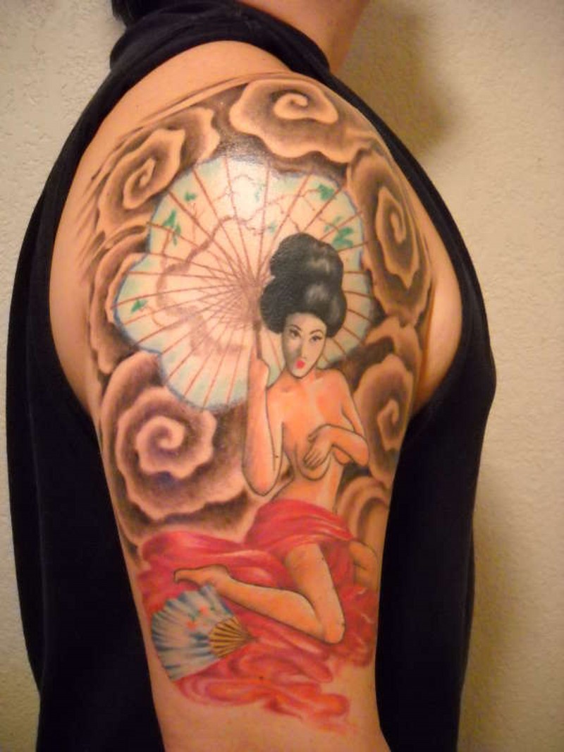 Asian style colored seductive geisha tattoo on shoulder with umbrella