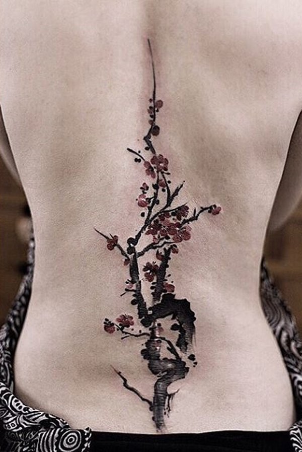 Asian style little natural colored back tattoo of tree