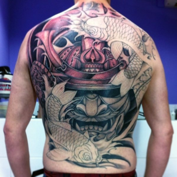 Asian style massive half colored tattoo of whole back with samurai helmet and carp-fishes