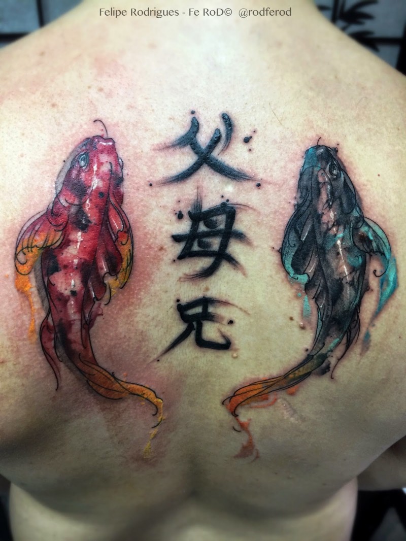 Asian style multicolored carp fishes tattoo on back combined with lettering
