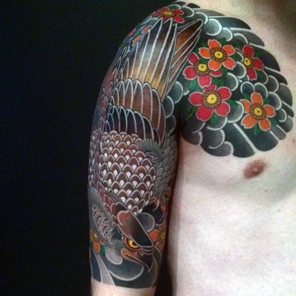 Asian style multicolored detailed eagle with flowers tattoo on shoulder