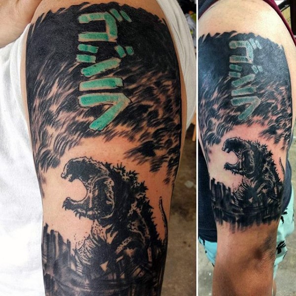 Asian style painted big black ink Godzilla shoulder tattoo