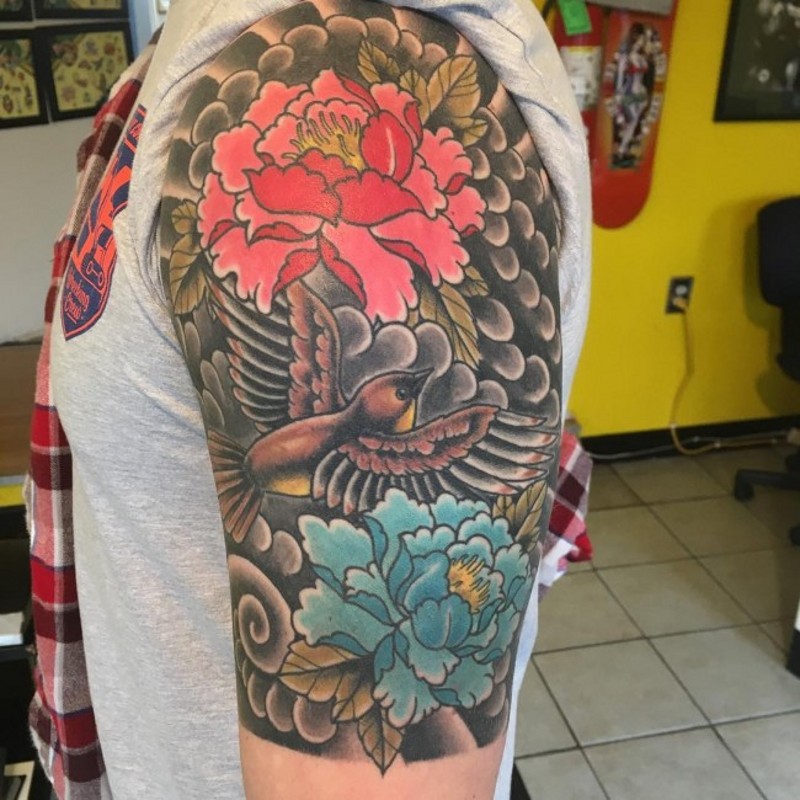 Asian style red and blue peony flowers and flying bird colored half sleeve tattoo