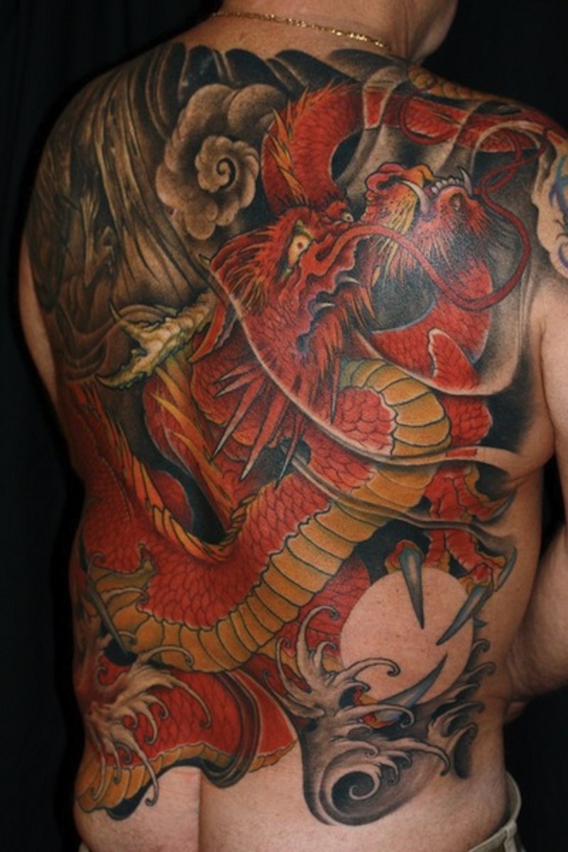 Asian traditional big colored whole back tattoo of detailed dragon