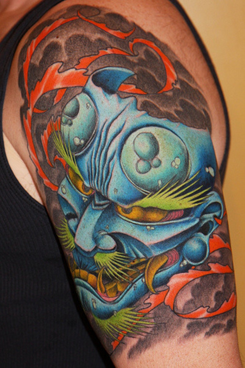 Asian traditional colored big shoulder tattoo of Asian demonic mask
