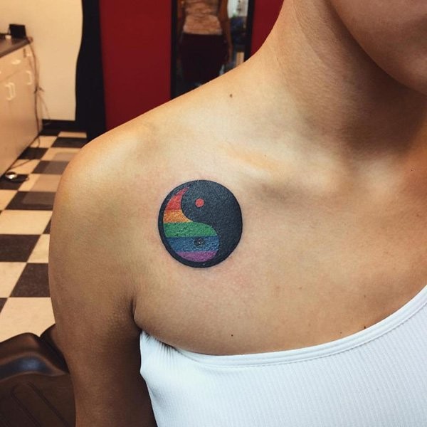 Asian Yin Yang special symbol with rainbow colored part shoulder tattoo